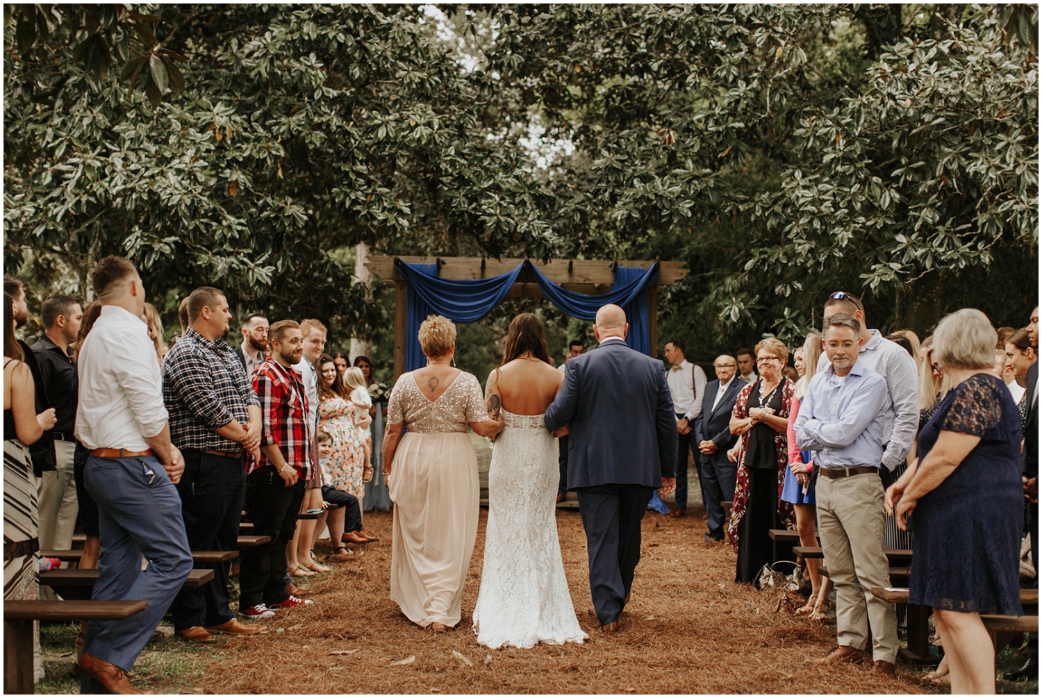  Bride walking down the aisle with her parents 