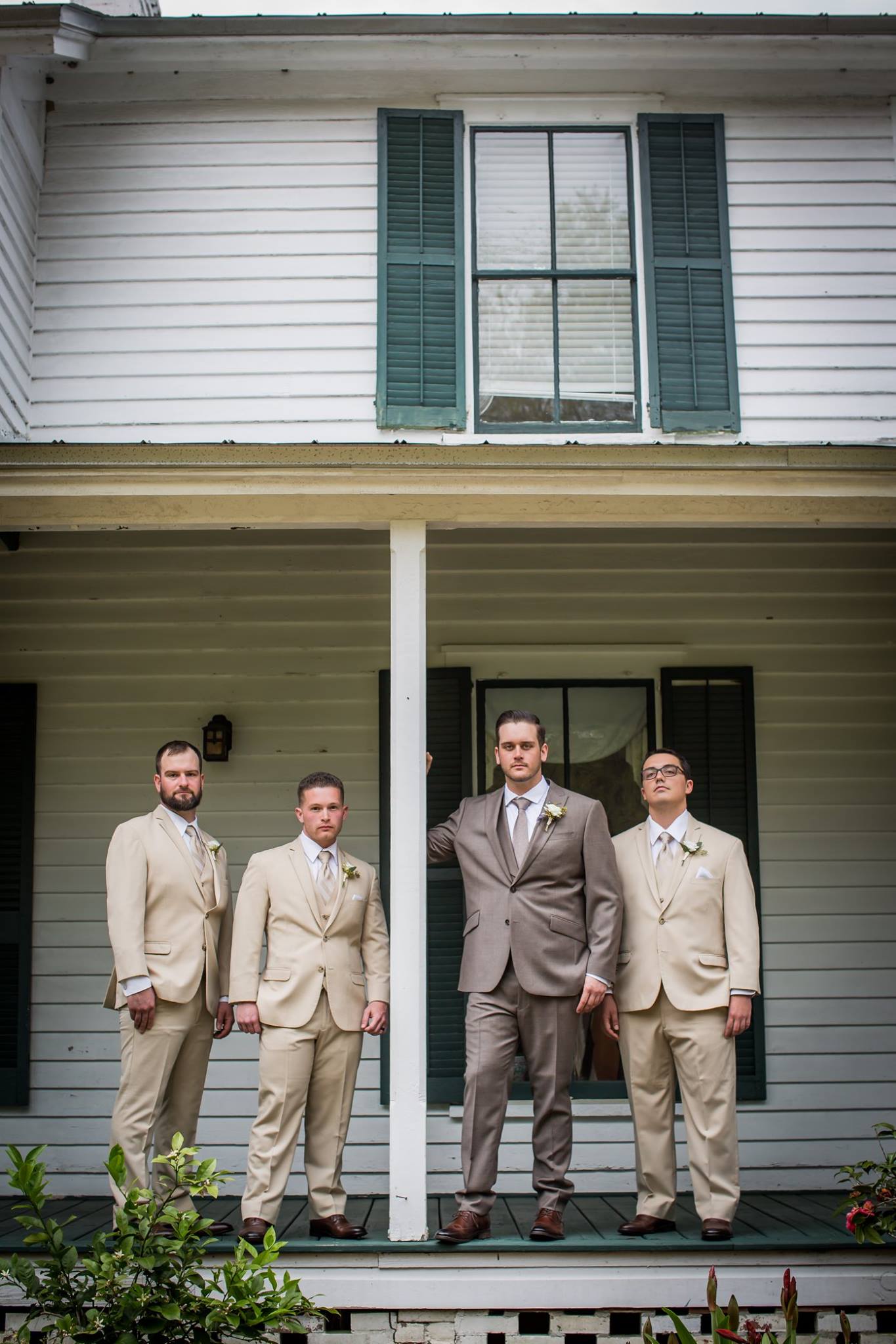 groom and the groomsmen in front of the glen venue 