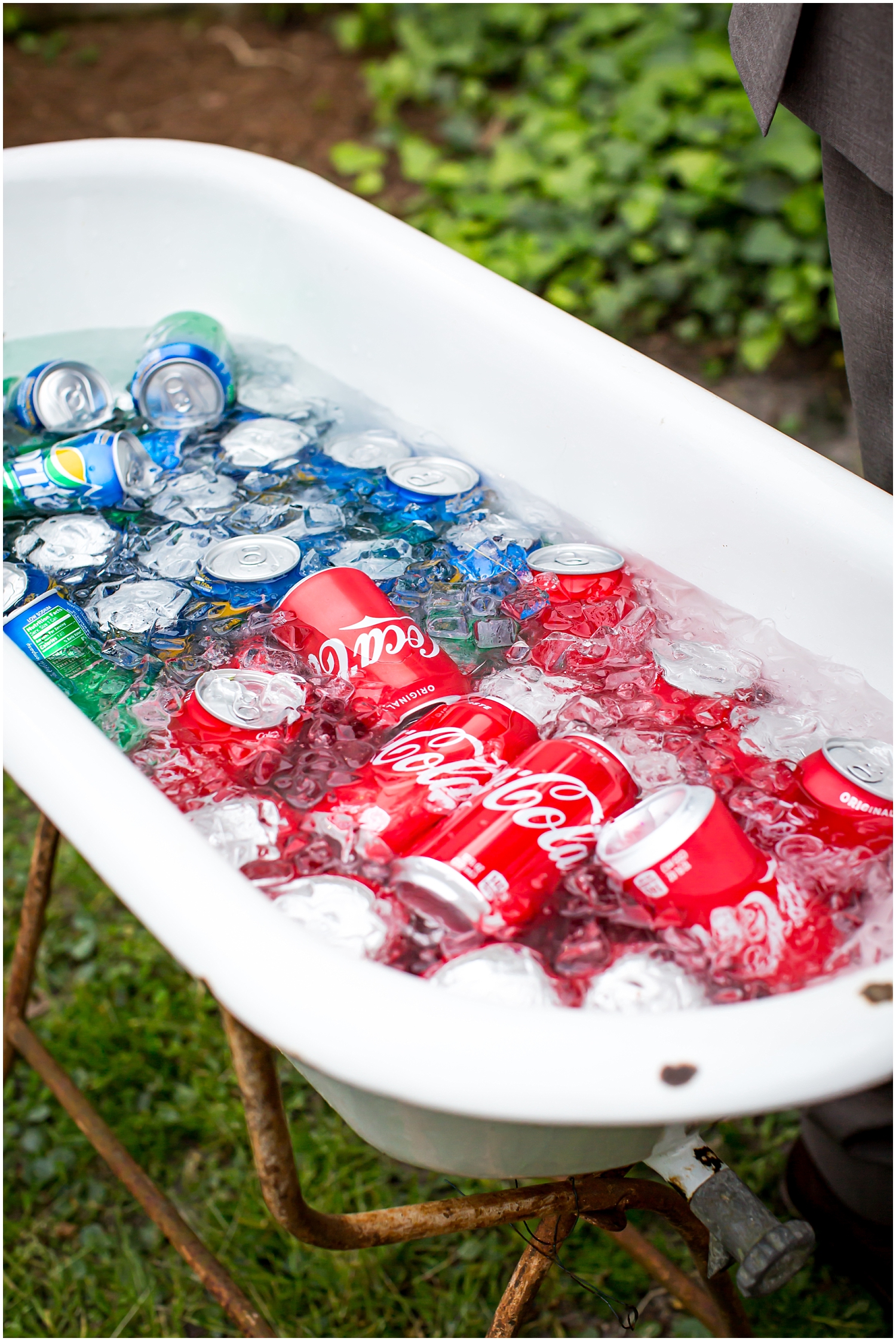  bath tub filled with soda cans 