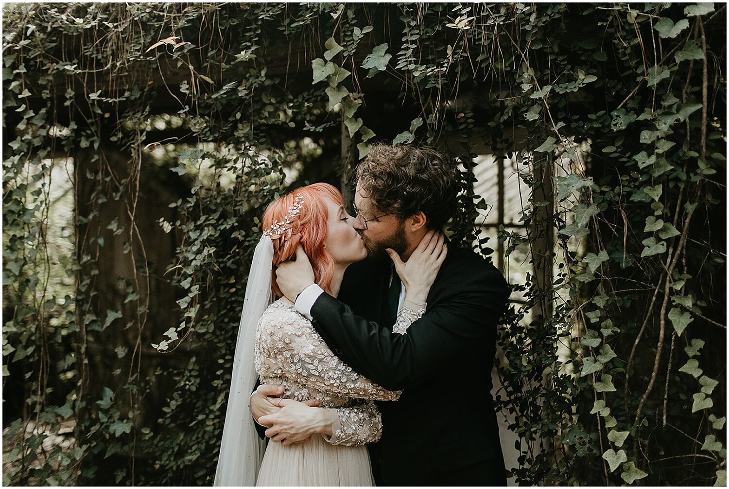  bride and groom portrait with greenery background 