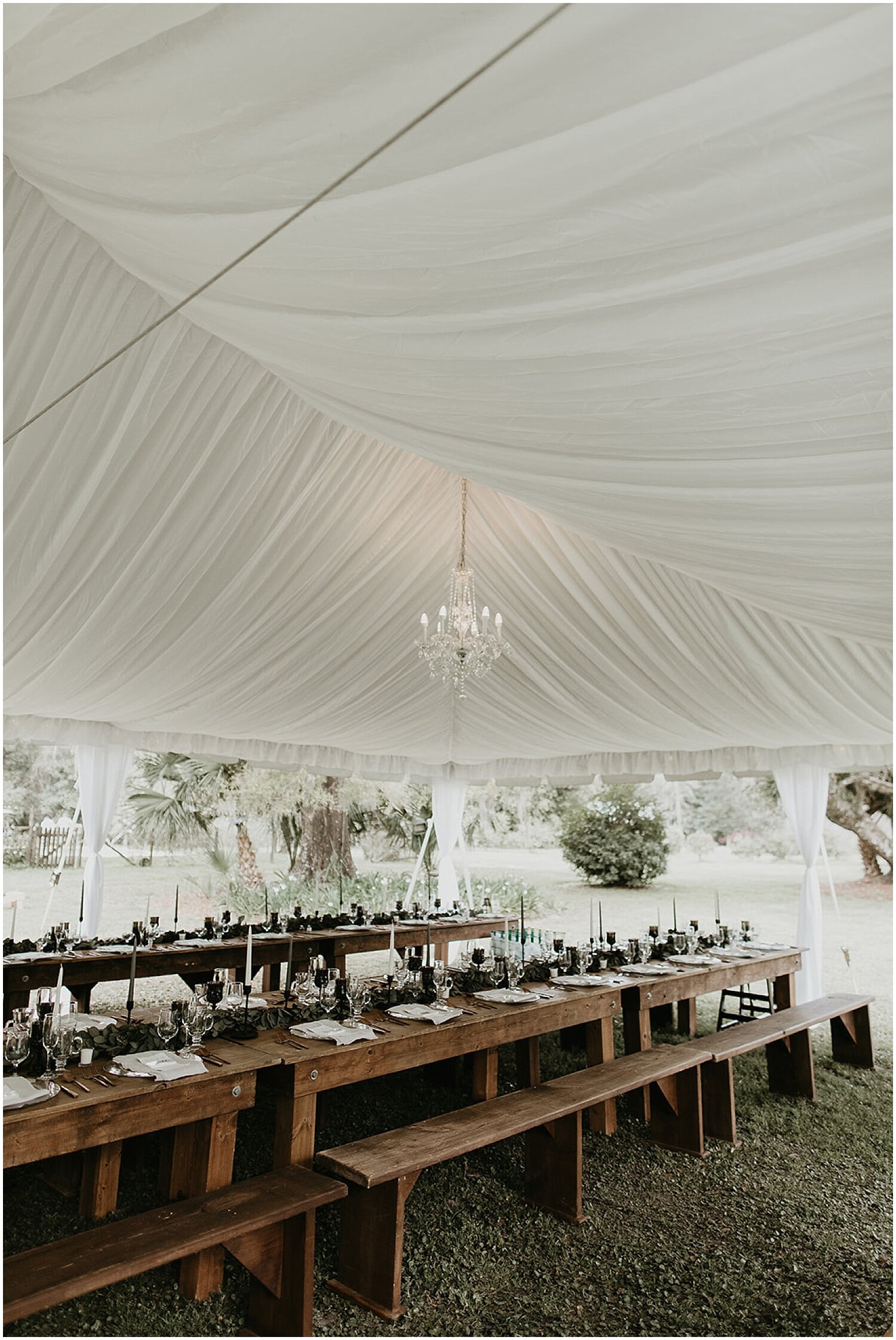  white tented reception with chandelier 