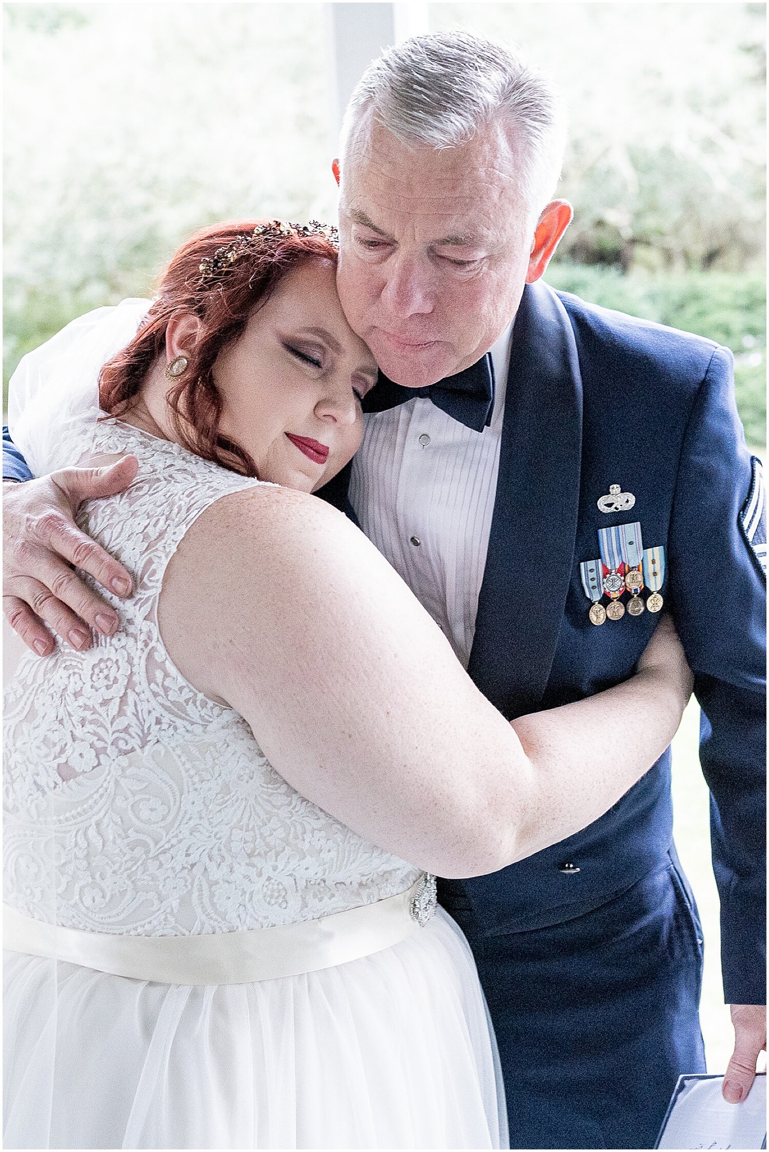  father and bride hug each other during their first look 