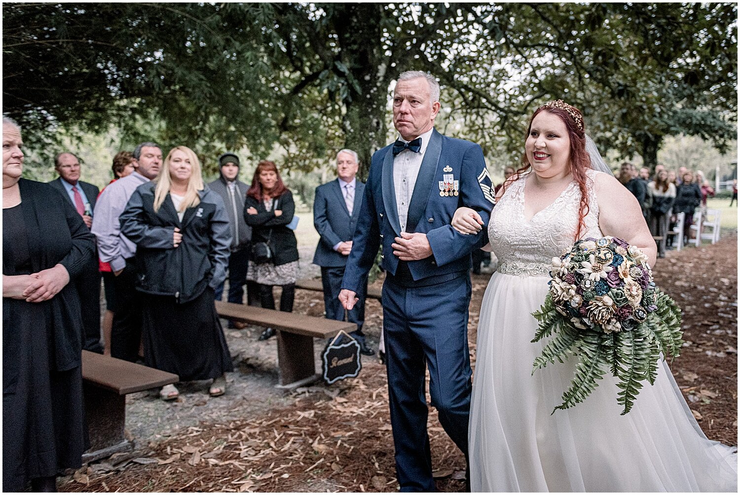  father and bride walk down the aisle 