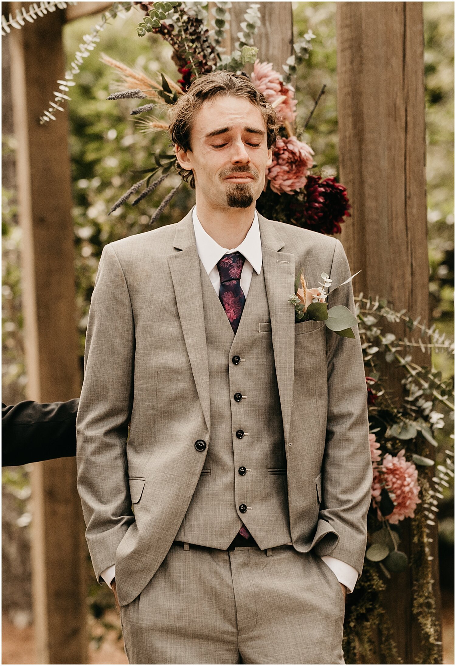  groom getting emotional while the bride walks down the aisle 