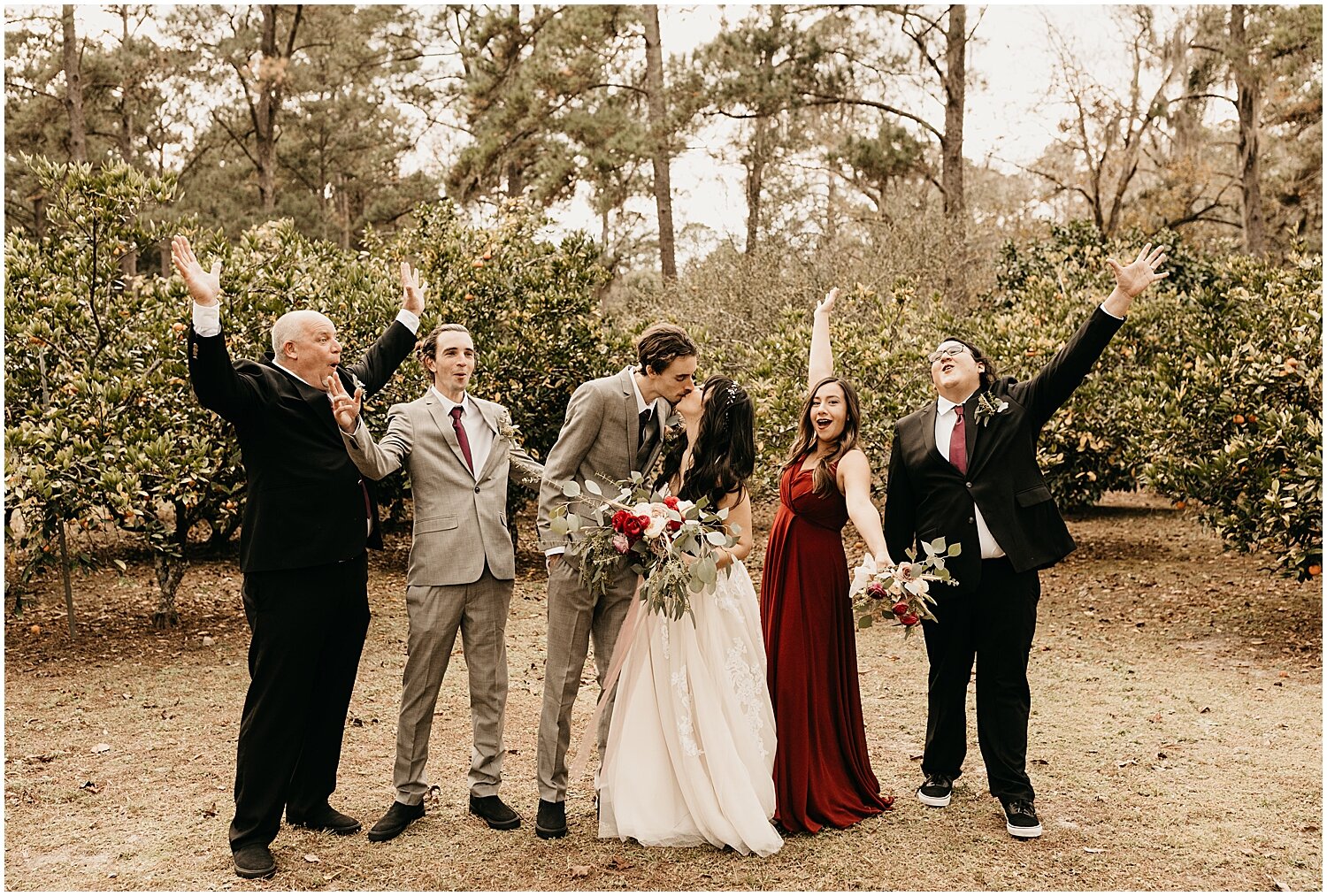  bride and groom with their bridal party 