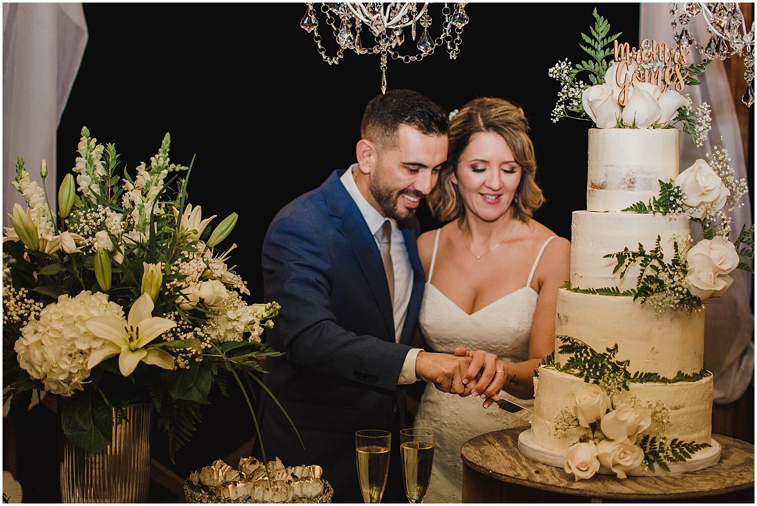  bride and groom cut their wedding cake  