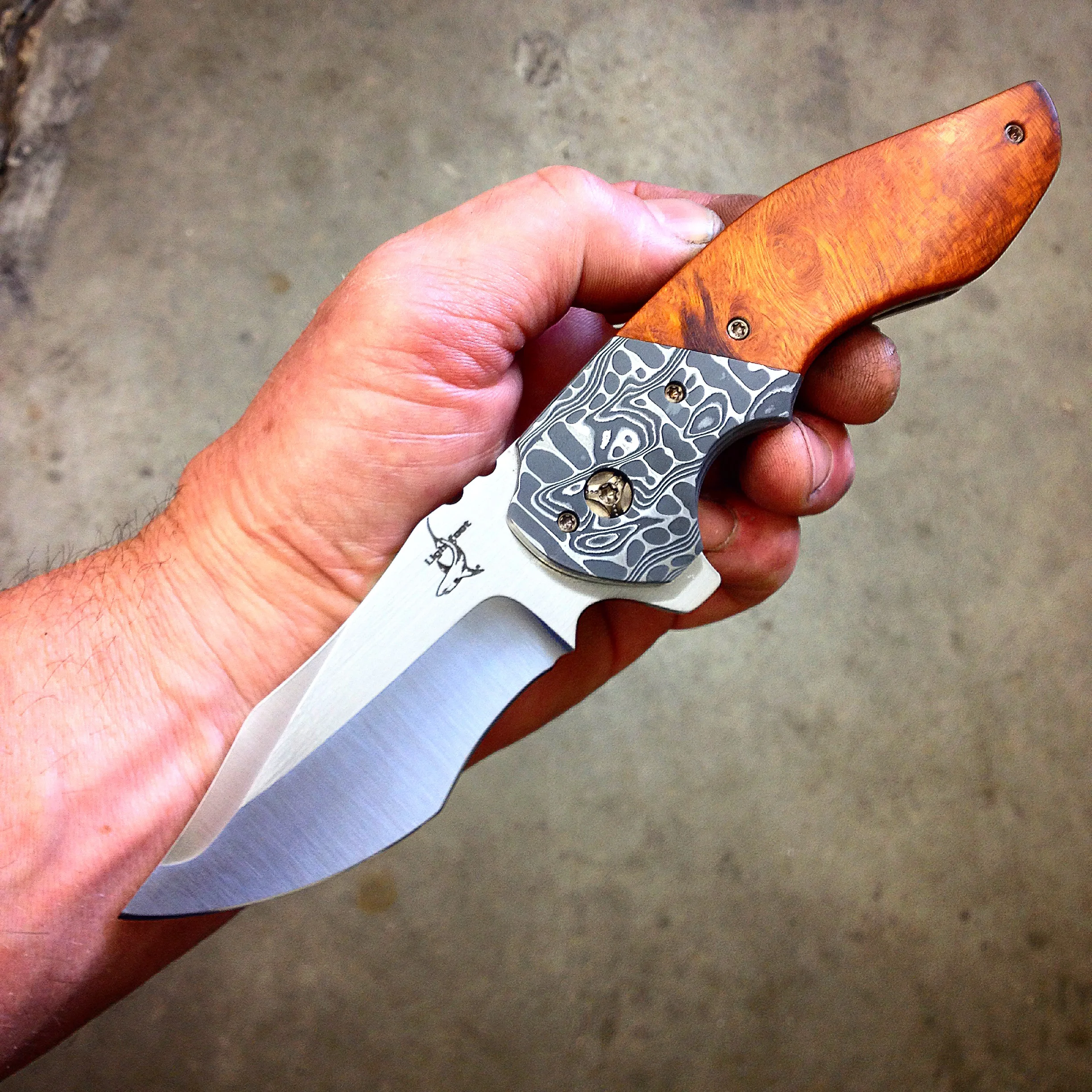 Empire with ironwood handles, Damascus bolsters, and satin recurve blade