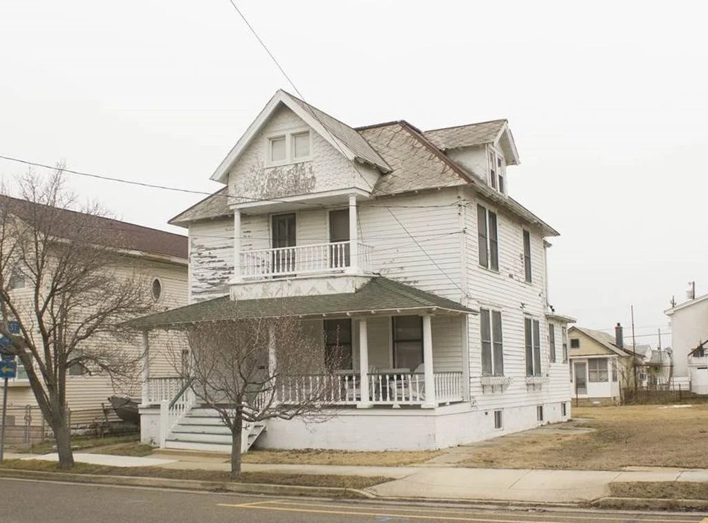 I've never seen a house with this exact design before - love the double porches!