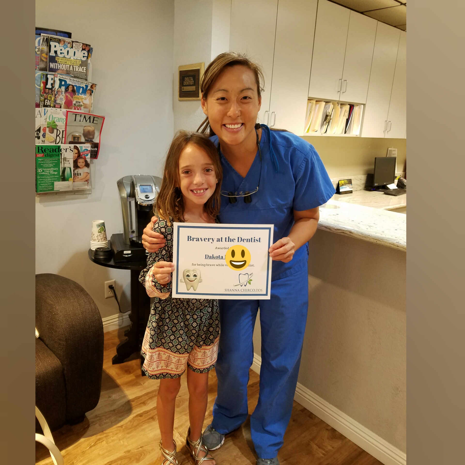 Dr. Chirco presenting a Bravery Award to a tough young dental patient!