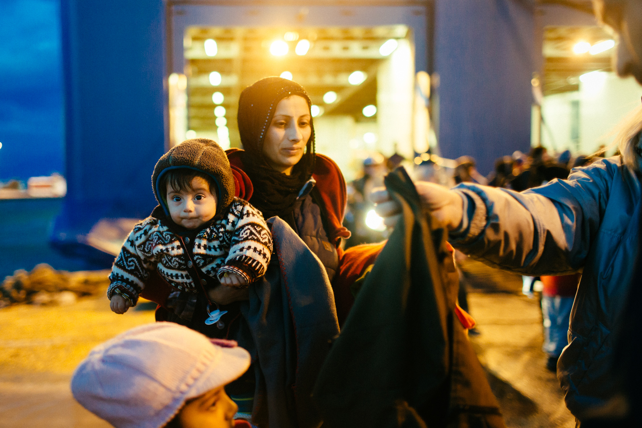 A family gathers themselves as they step foot off the ferry and onto mainland Europe.