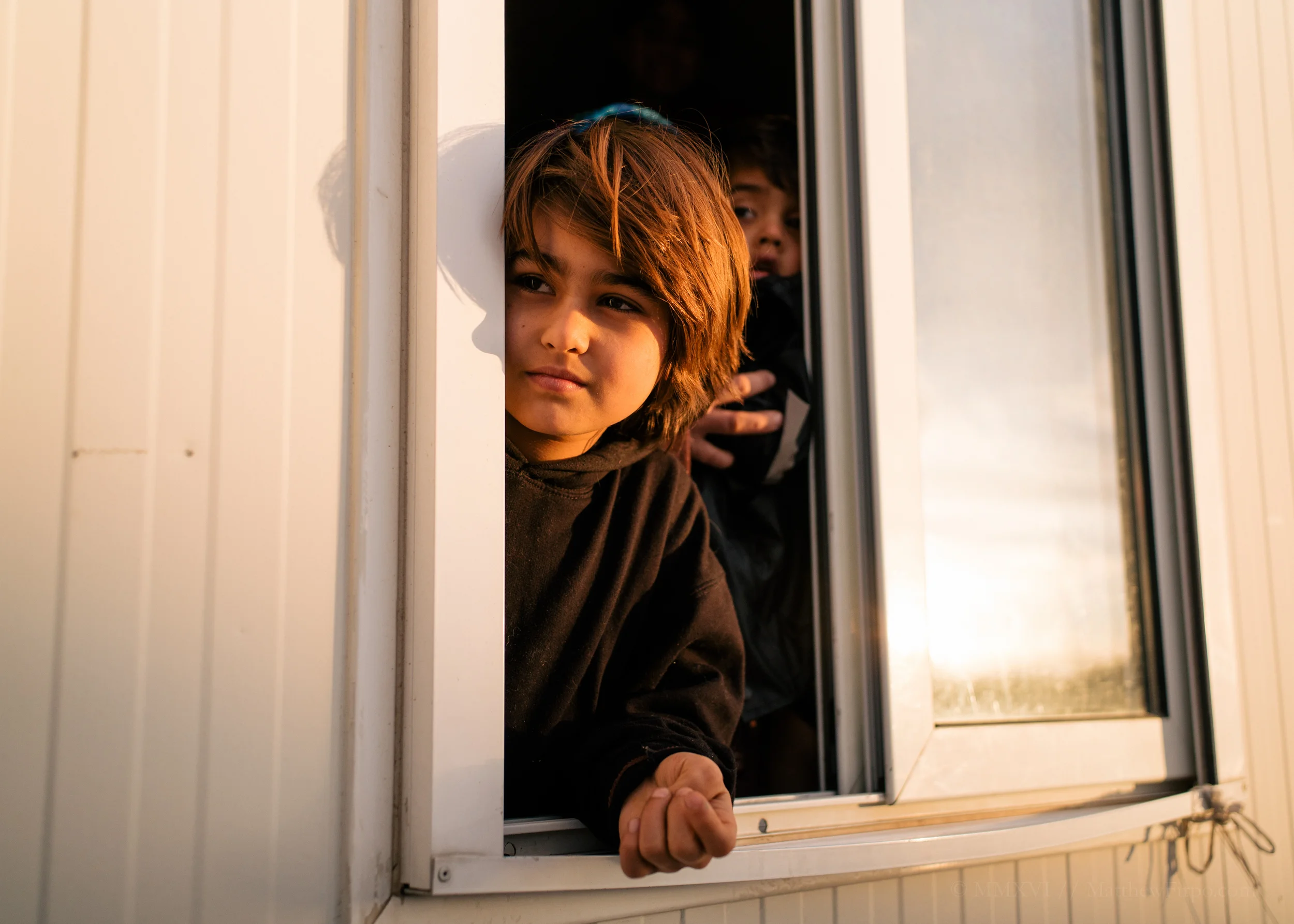 Zaina, Patiently Awaiting Eleonas Refugee Camp, Athens | 37.9827° N, 23.6988° E A Farsi-speaking Afghan tomboy, Zaina was all quiet energy and bright eyes. And in the last light of our final day, all she could seem to see or talk about was the future that lay ahead.