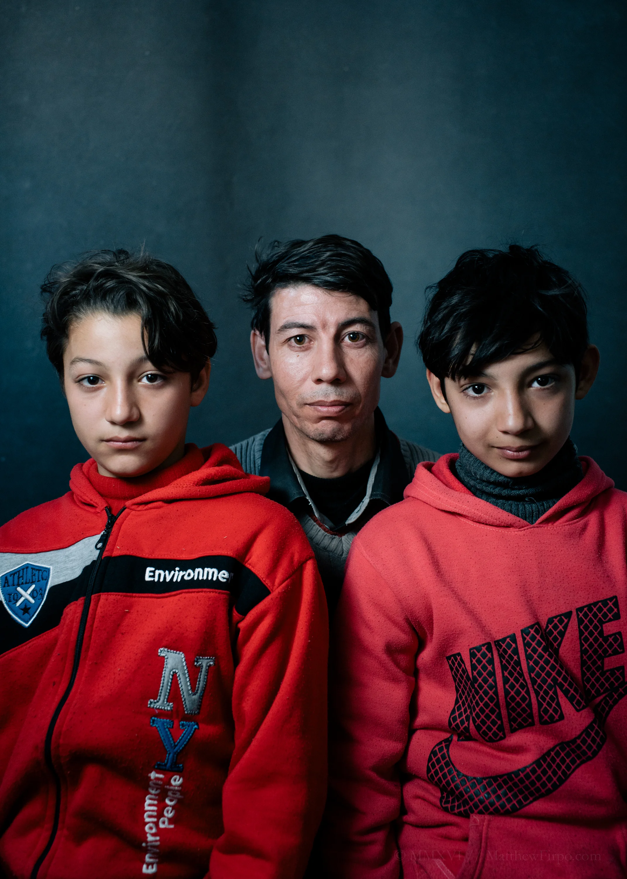 Redwan's Story Leros Refugee Camp, Greece | 37.1305° N, 26.8497° E Redwan and his two sons are looking for a better life. Away from the missile strikes that destroyed their home, and the Regime that imprisoned Redwan for months without trial or sentence. When I asked him, simply, what was the hardest part about leaving his homeland behind, Redwan said that it was telling his boys, Mohammed (right) and Abdul-Rahman (left), that they might not ever see their Syria again. And even as he explained this to me, Mohammed, his eldest, began to softly cry, mourning the loss of his home, his homeland, and everything he has ever known. Redwan is seeking political asylum in the west, looking only for the opportunity to get his son's an education, to work hard, and, as he explained: "to actually live again, without bombs and death and hate."