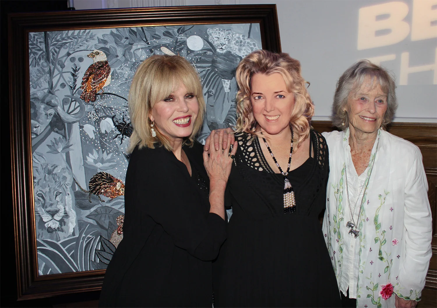 'THE UNKNOWN' Swarovski crystals, rhinestones, acrylic & oil paint on canvas. 51 x 51 inches (130cm x 130cm). With Joanna Lumley and Virginia McKenna of The Born Free Foundation. “The Unknown” is an allegorical painting about power disparities. It focuses on the “Little Five”: Leopard Tortoise, Elephant Shrew, Rhino Beetle, Buffalo Weaver and Ant Lion, as opposed to the usual “Big Five” who, this time, are hidden in the Rousseau inspired background.