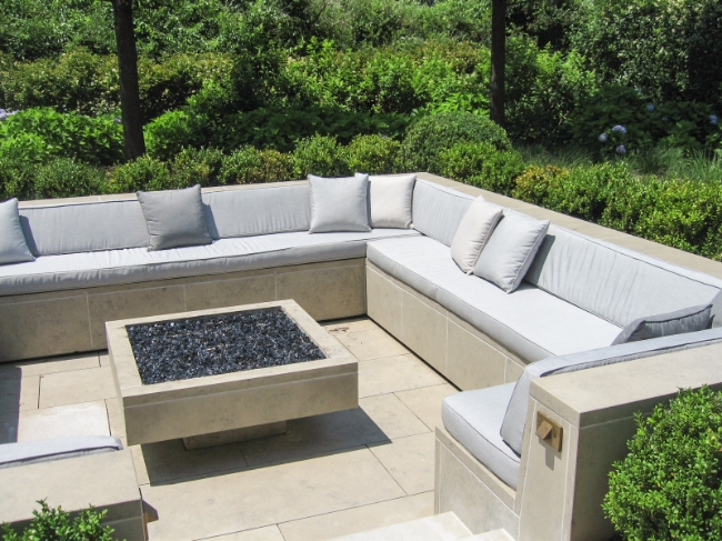 Amagansett, NY. Fire pit's custom cushions: seats, backs, throw pillows. Outdoor foam with Sunbrella fabrics in three grey tones.