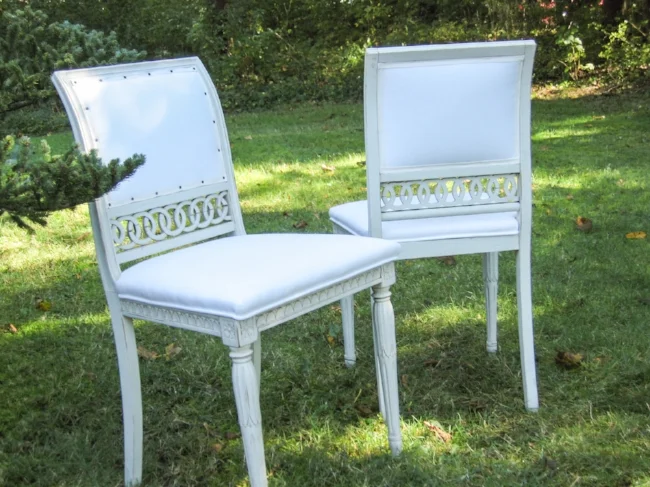 Two of a set of six side chairs.