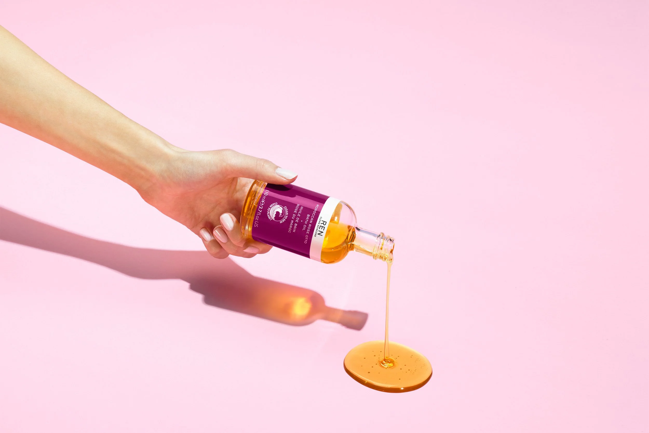 4355-REN-MOROCCAN-ROSE_OIL-IN HAND.jpeg
