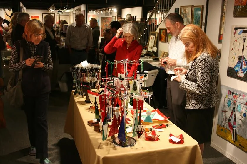 Jewelry artists' wonderful holiday/Christmas ornaments and glassware are on display.