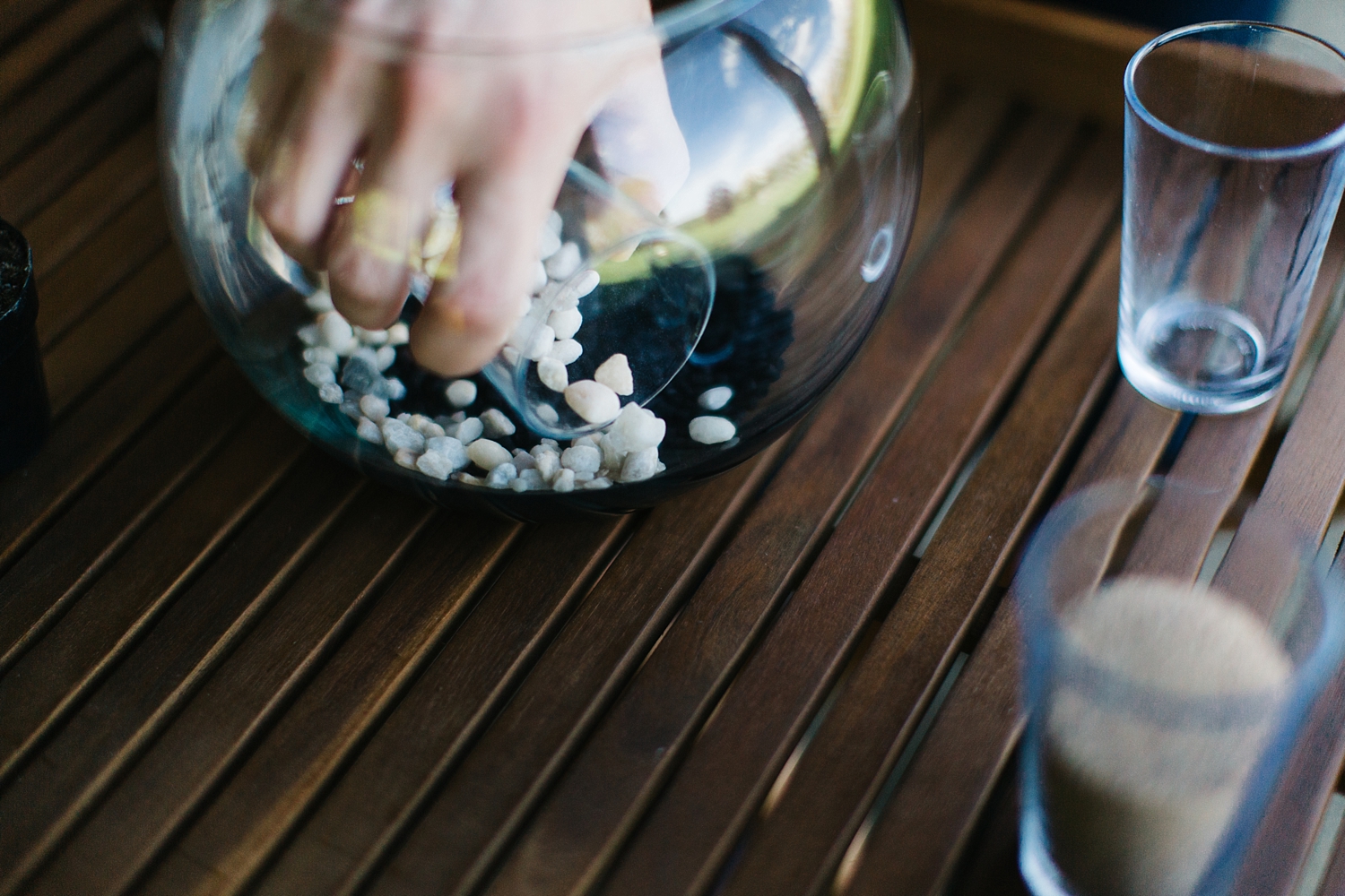 Next, build your base layer of rocks up the side of the bowl, leaving a well in the middle which you will place your soil into.