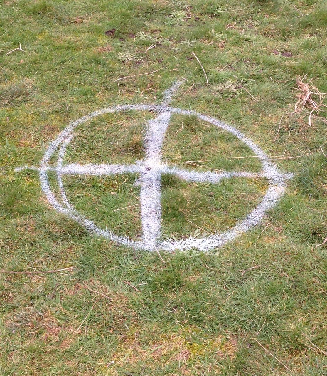 An enthusiastic marking of the centre of the grass circle, which won't become a helicopter landing pad or, hopefully, attract aliens.