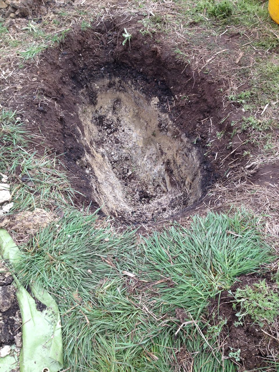 A hole big and deep enough to lie in - suggestion of making it into a hot tub.