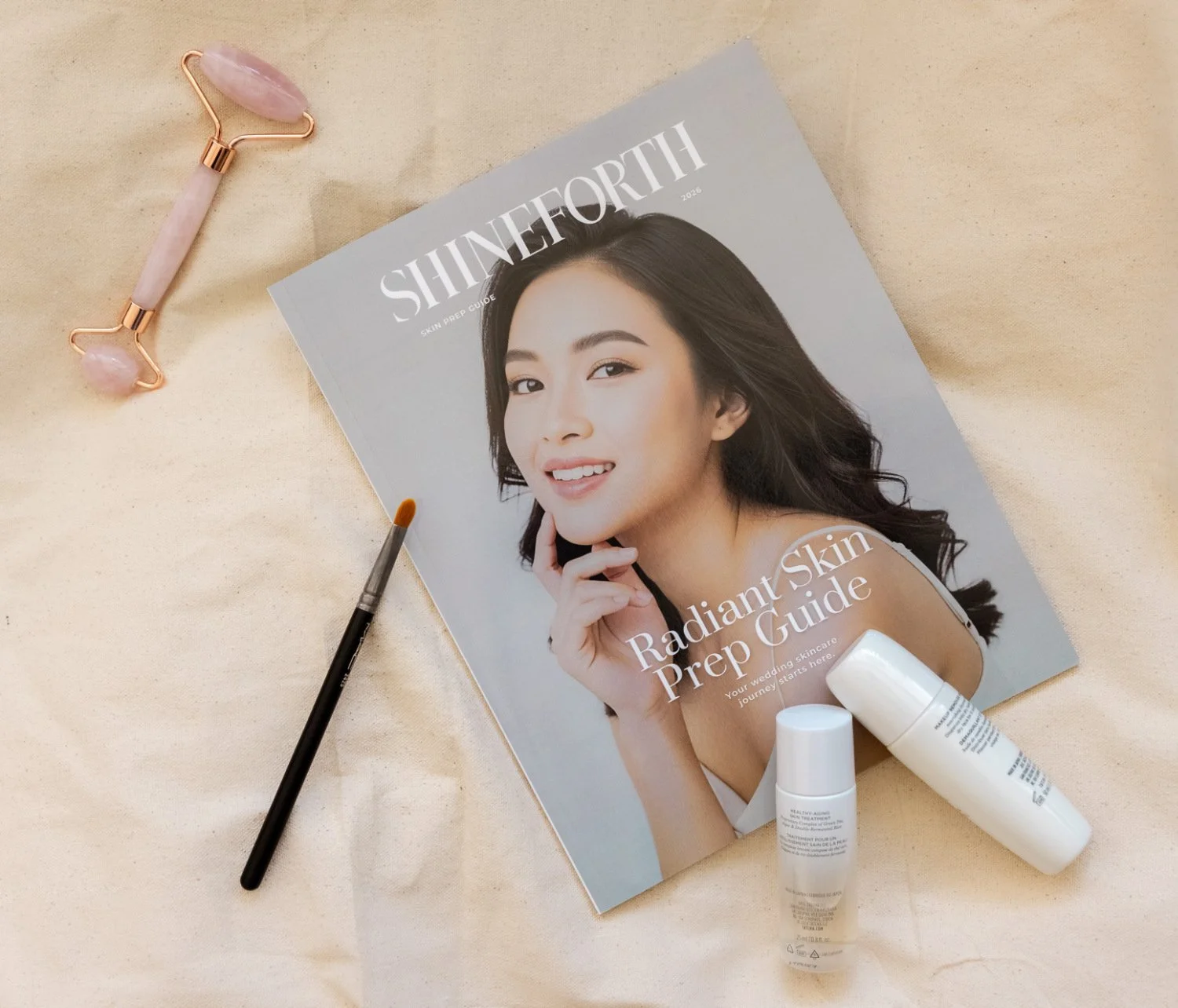 The ShineForth Radiant Skin Prep Guide printed book surrounded by beauty products