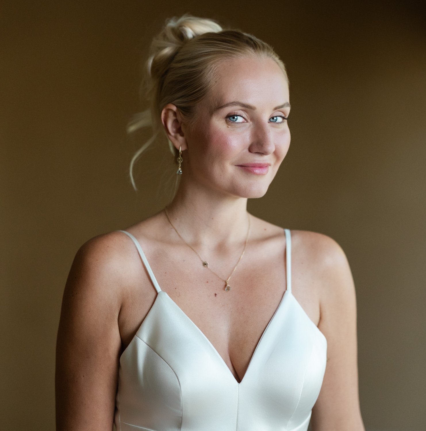 Model wearing radiant bridal makeup and a chic modern hairstyle showcasing ShineForth Beauty’s refined aesthetic.