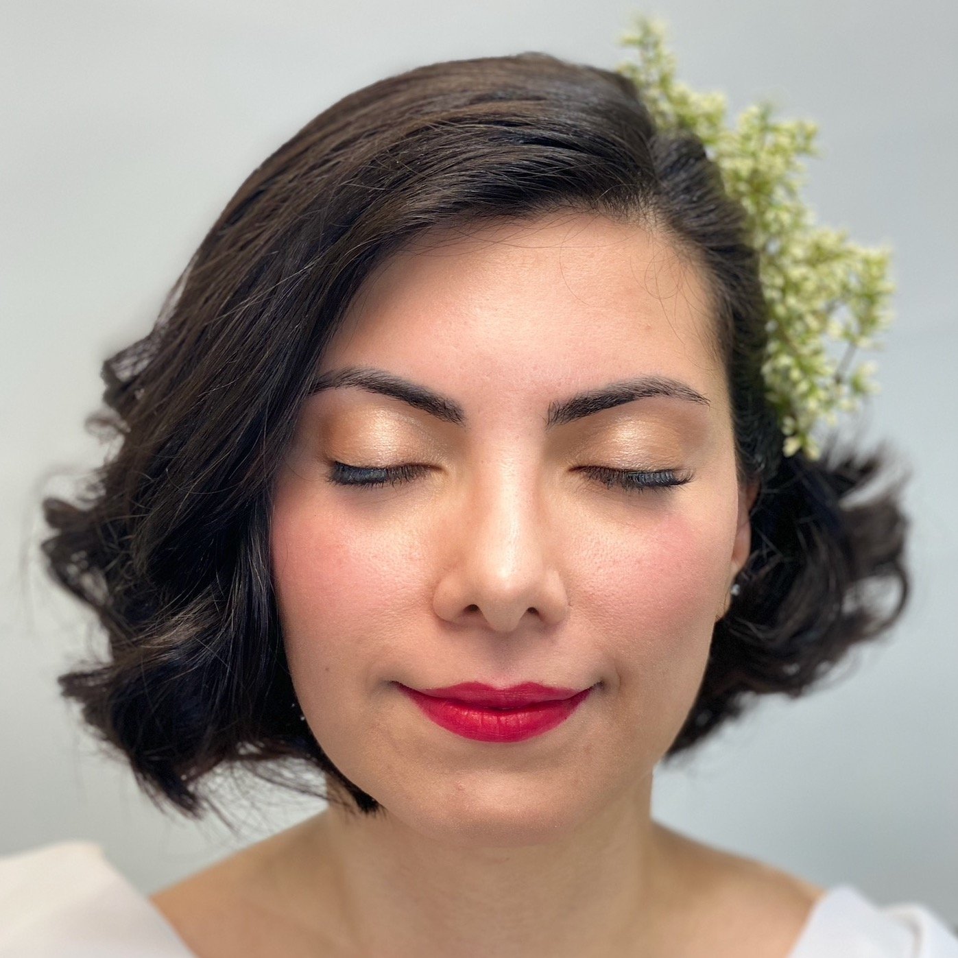 Natural bob wedding hairstyle with hair accessory. Fresh and radiant bridal makeup with a red lip, SF City Hall 