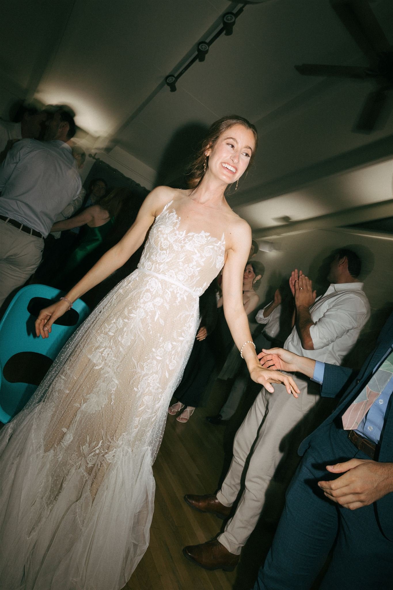 Bride dancing at wedding reception, natural radiant bridal makeup and hair designed to move effortlessly.