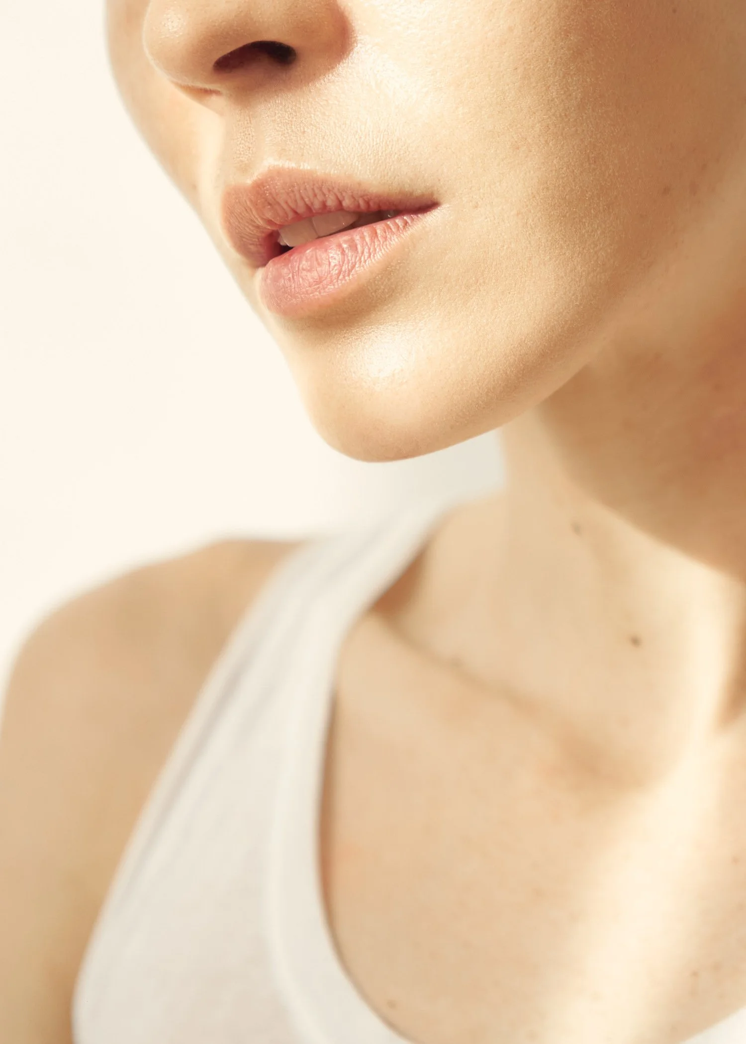 Detail of lower part of woman's face in sunlight