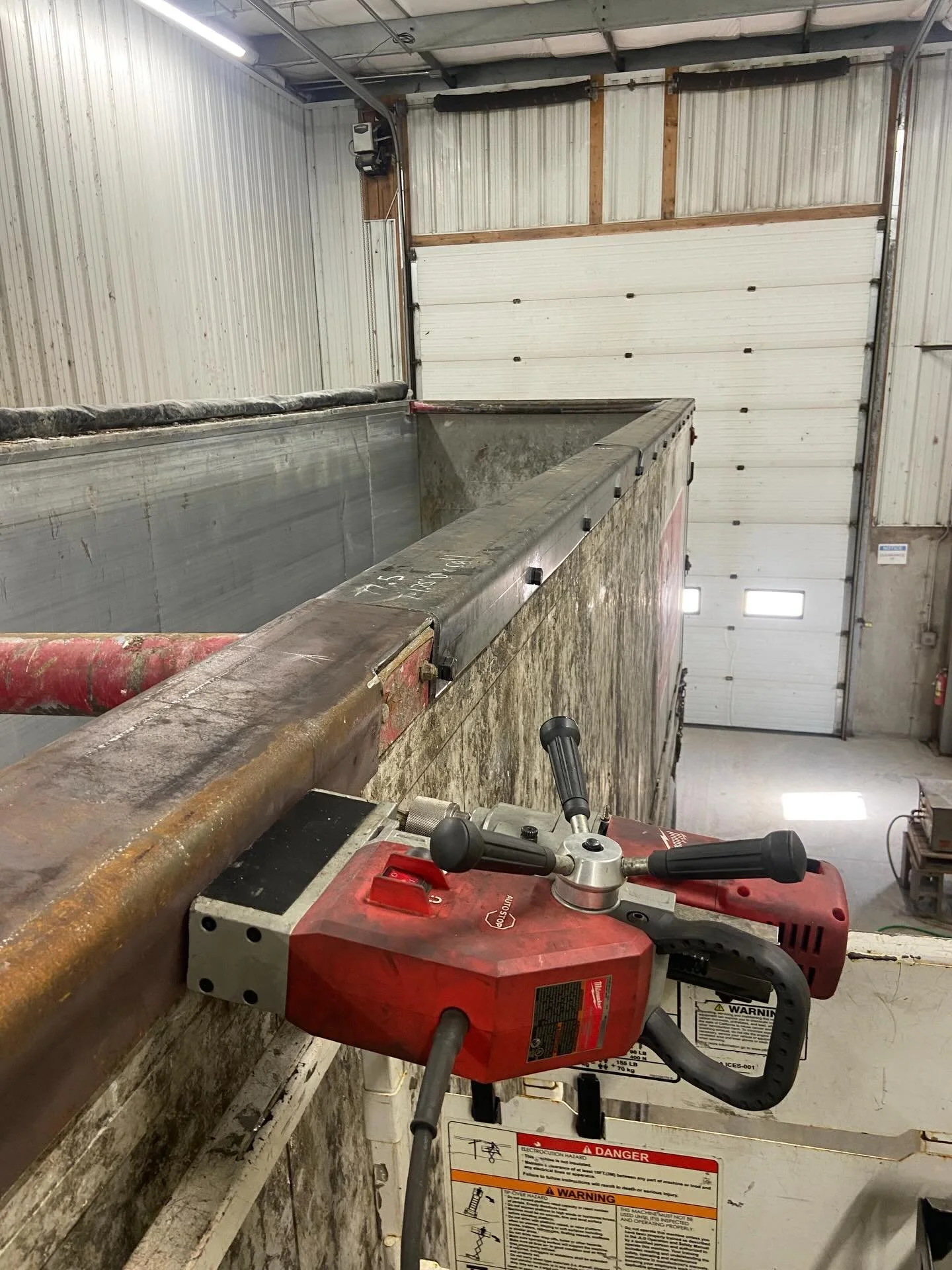 Custom C-channel shape wall cap on this aluminum walking floor trailer. The operators keep tearing holes in it when they try to clean off the top edge of the trailer with the grapple. Repaired all holes with new aluminum pieces and installed the 3/8&