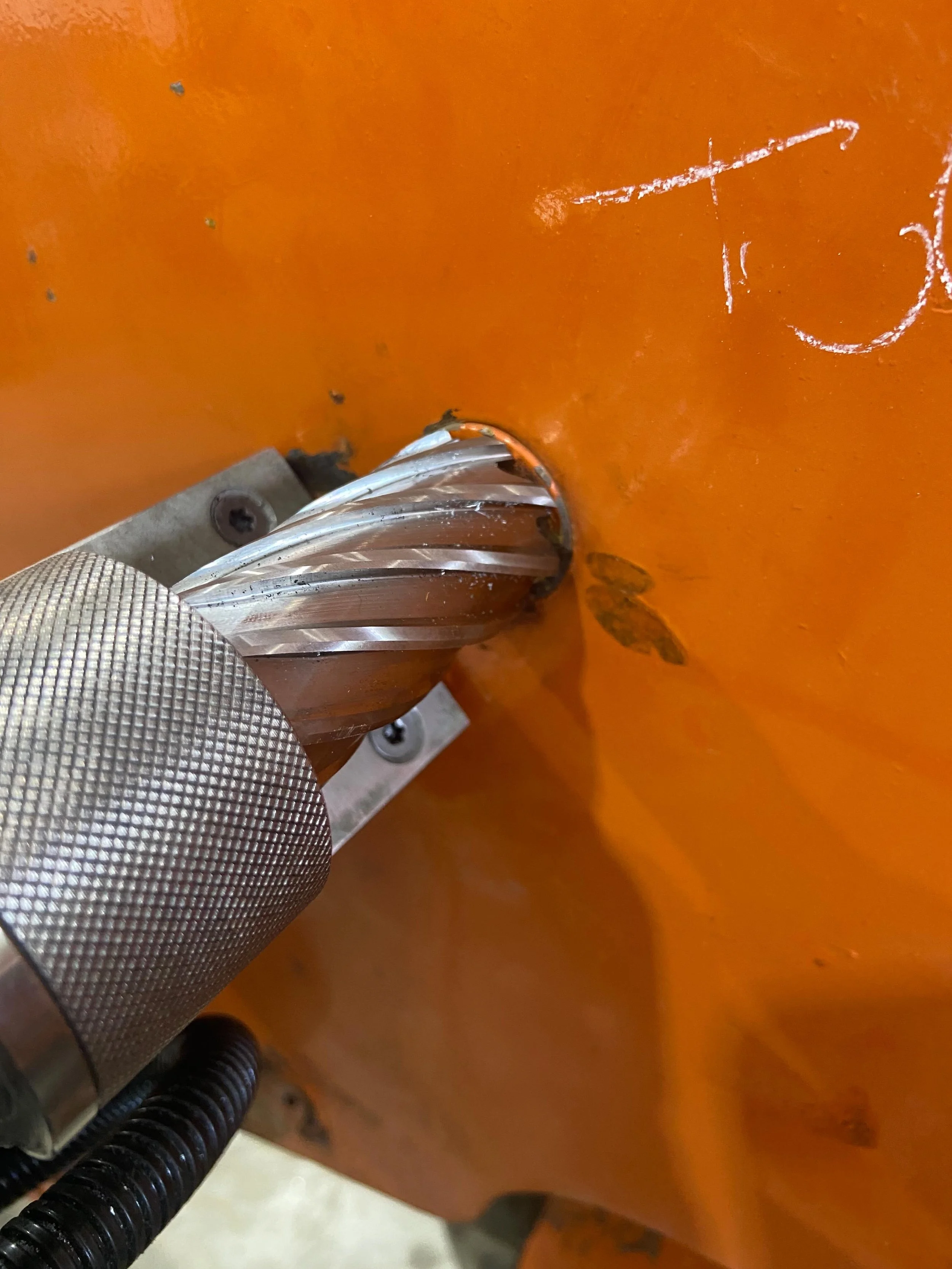 Seized pin/boss removal. Rather then attempt to getting this pin out completely I chose to cut out the whole boss assembly with the stuck pin in it and replace it with a larger diameter boss and larger pin. The annual cutter worked out well drilling 