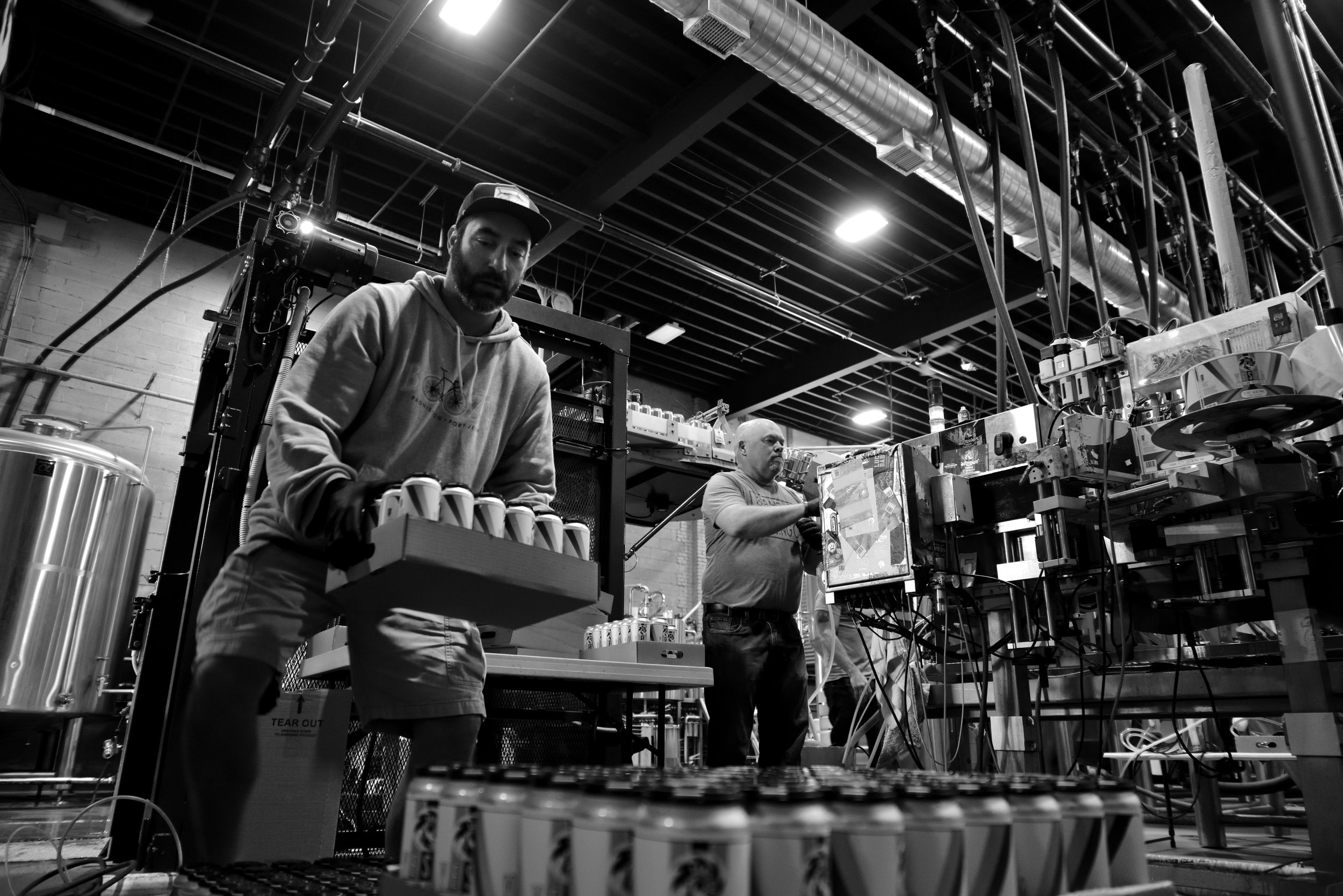 035.MARK STACKS THE DAYS YIELD AS TOM PACKS CASES.jpg