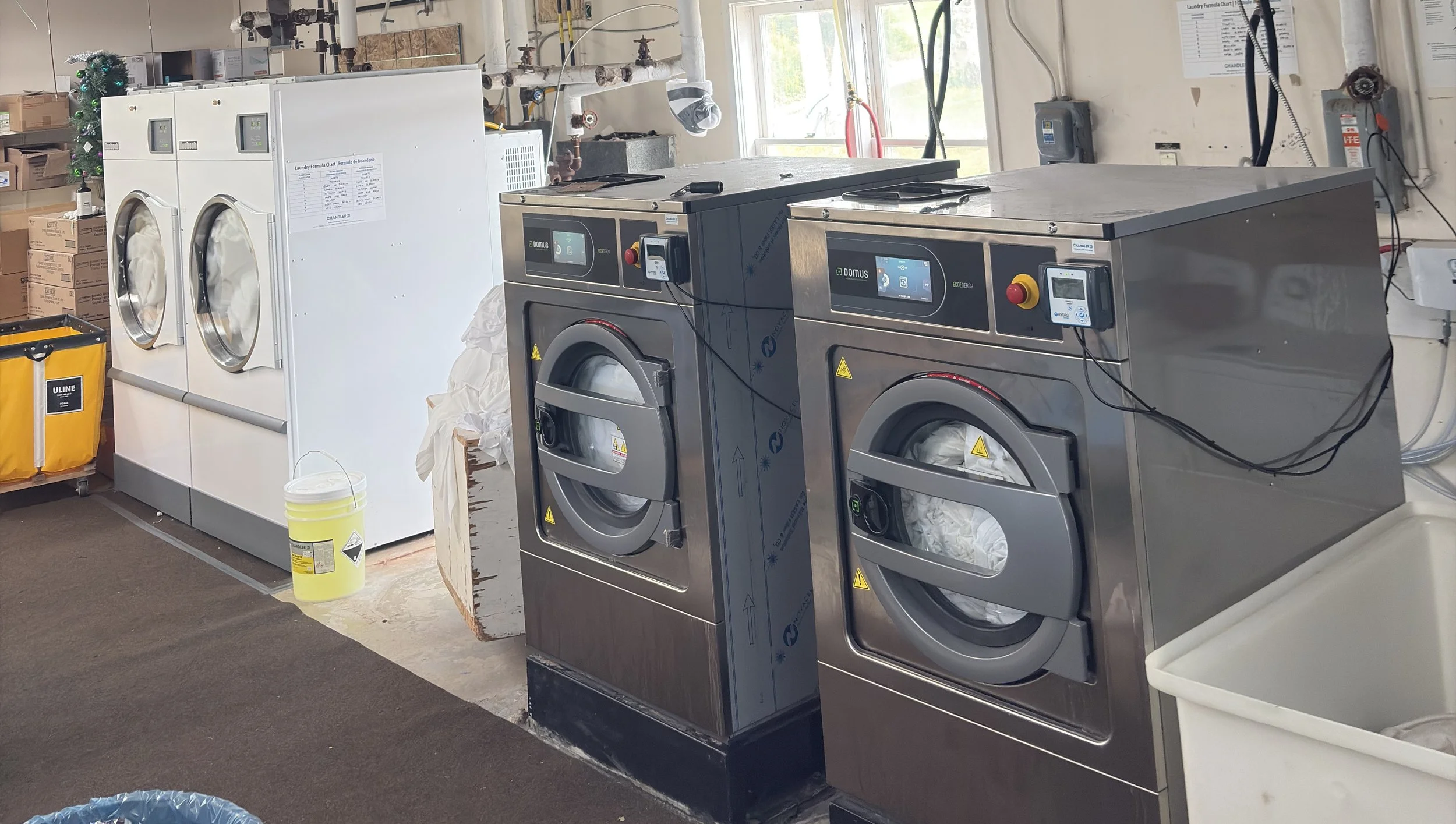 Photo: Domus 65 lb Washers and Huebsch Dryers installed