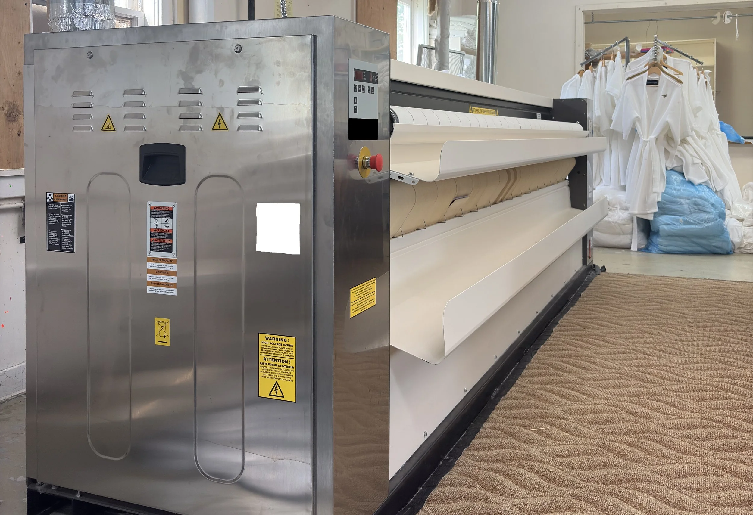 Photo: New Domus ironer in operation