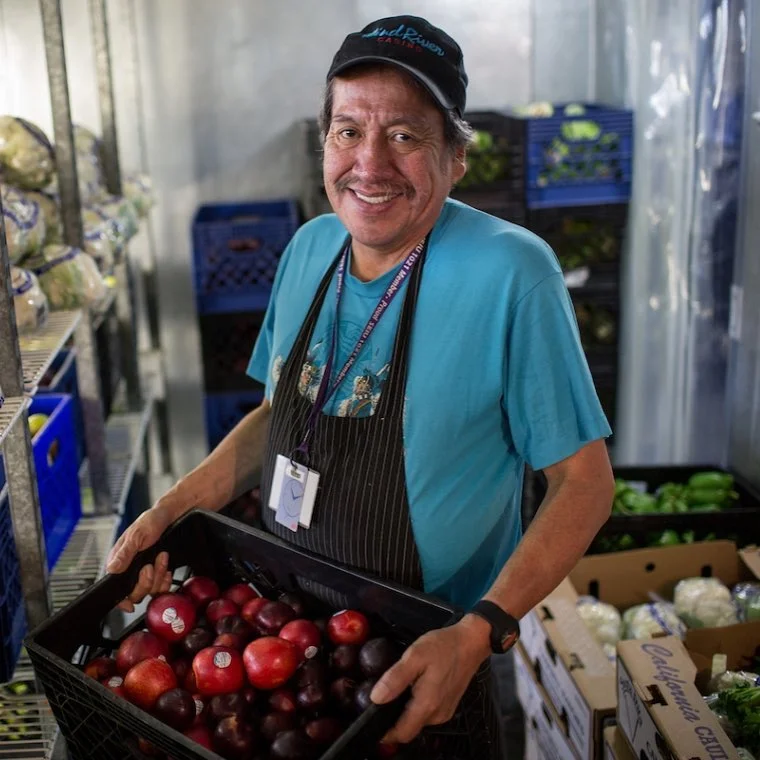 Sorting groceries is a huge task when you prepare 2,500 daily meals. Photo courtesy of Project Open Hand.