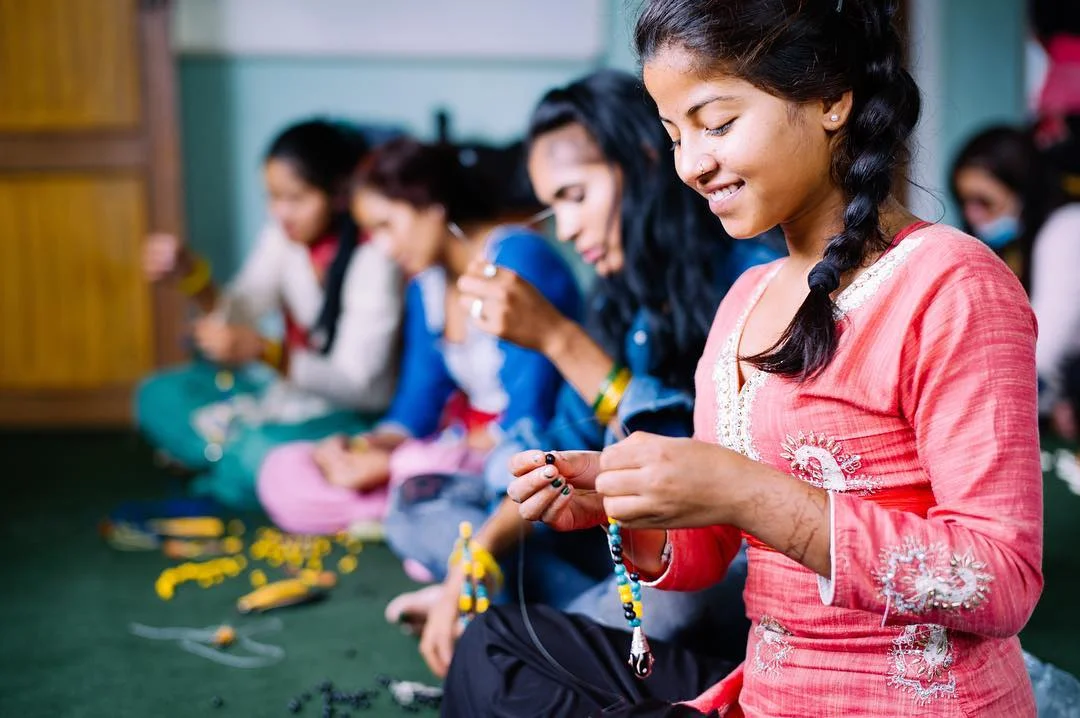 Human trafficking survivors create necklaces and braceletes at the She Has Hope Rehabilitation Center. Photo courtesy of She Has Hope.