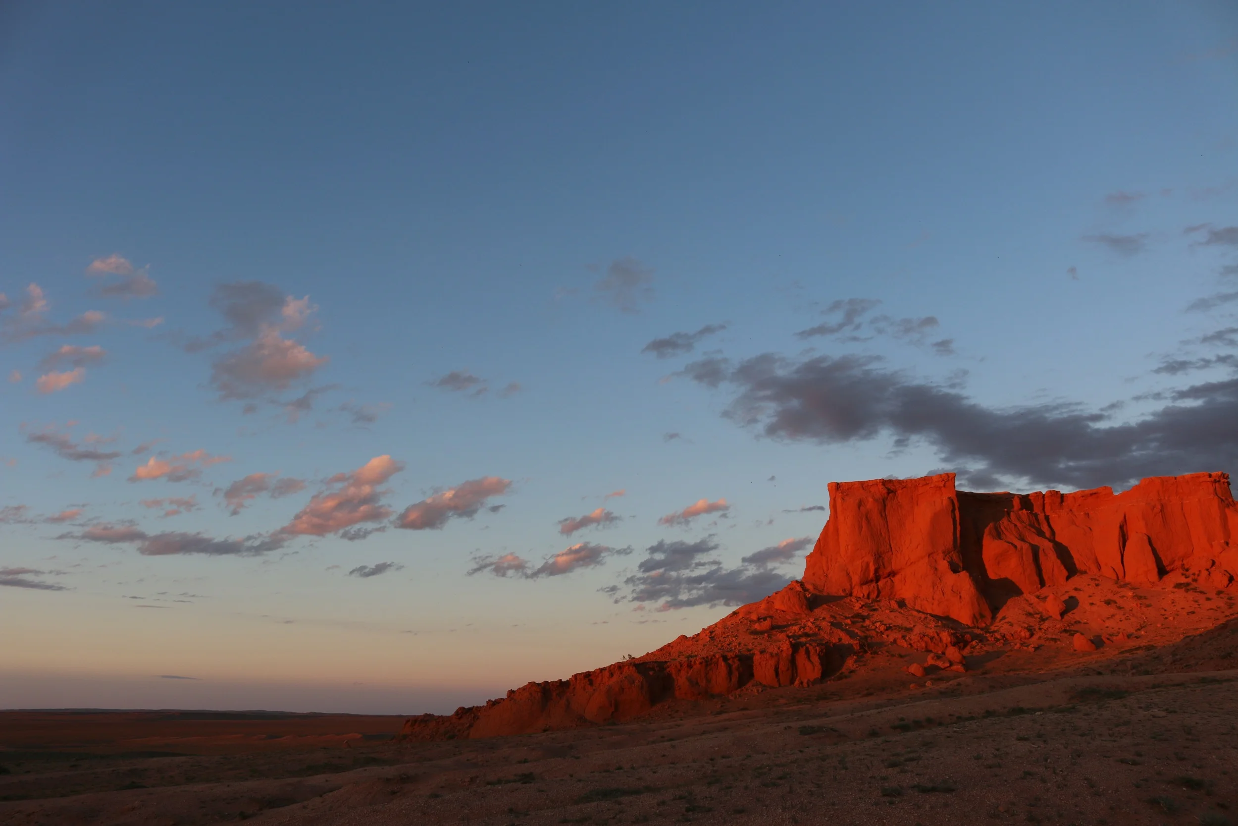 Red rocks at sunset in Mongolia's Gobi Desert. 