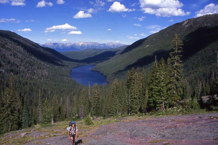 A backpacker works his way up to High Park Lake in the Mission Mountains