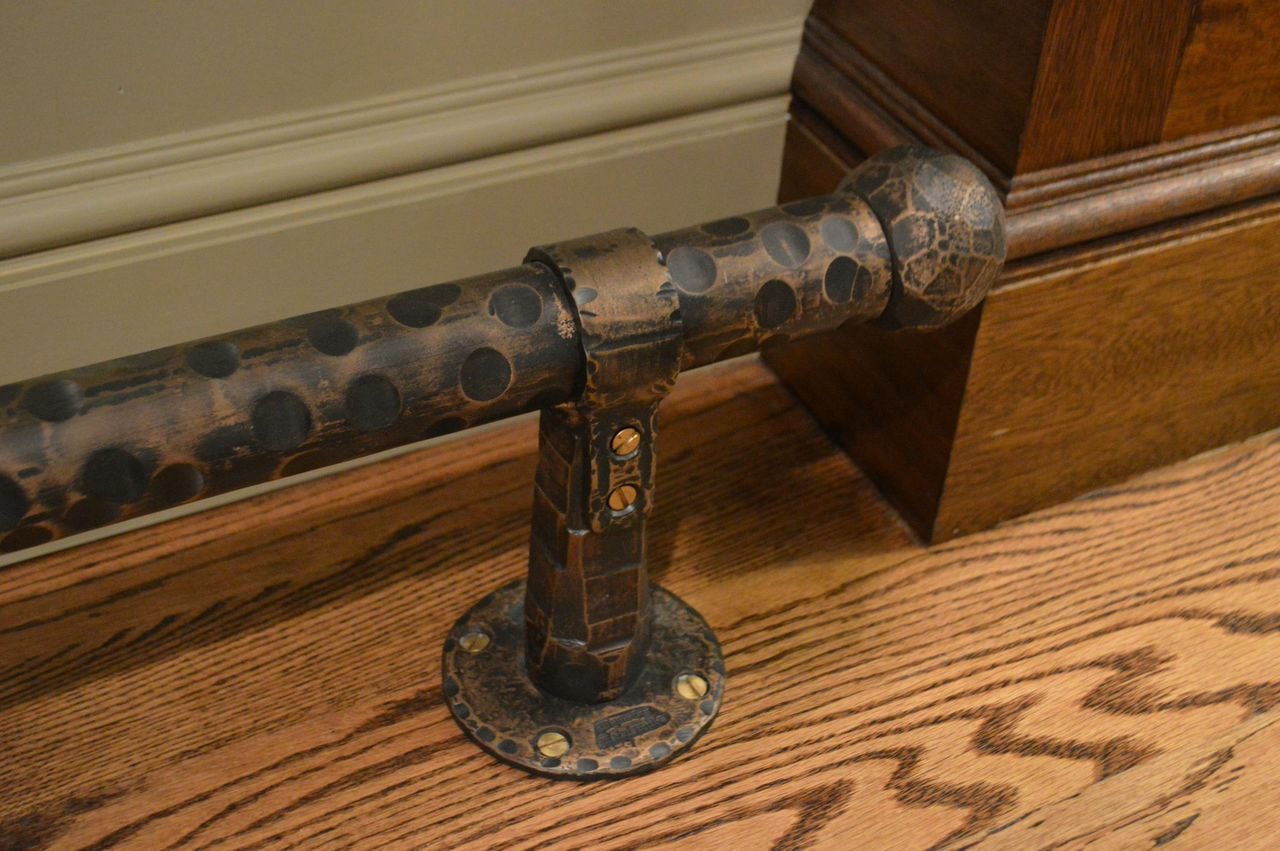 A custom designed metal bar foot-rail from Montana.