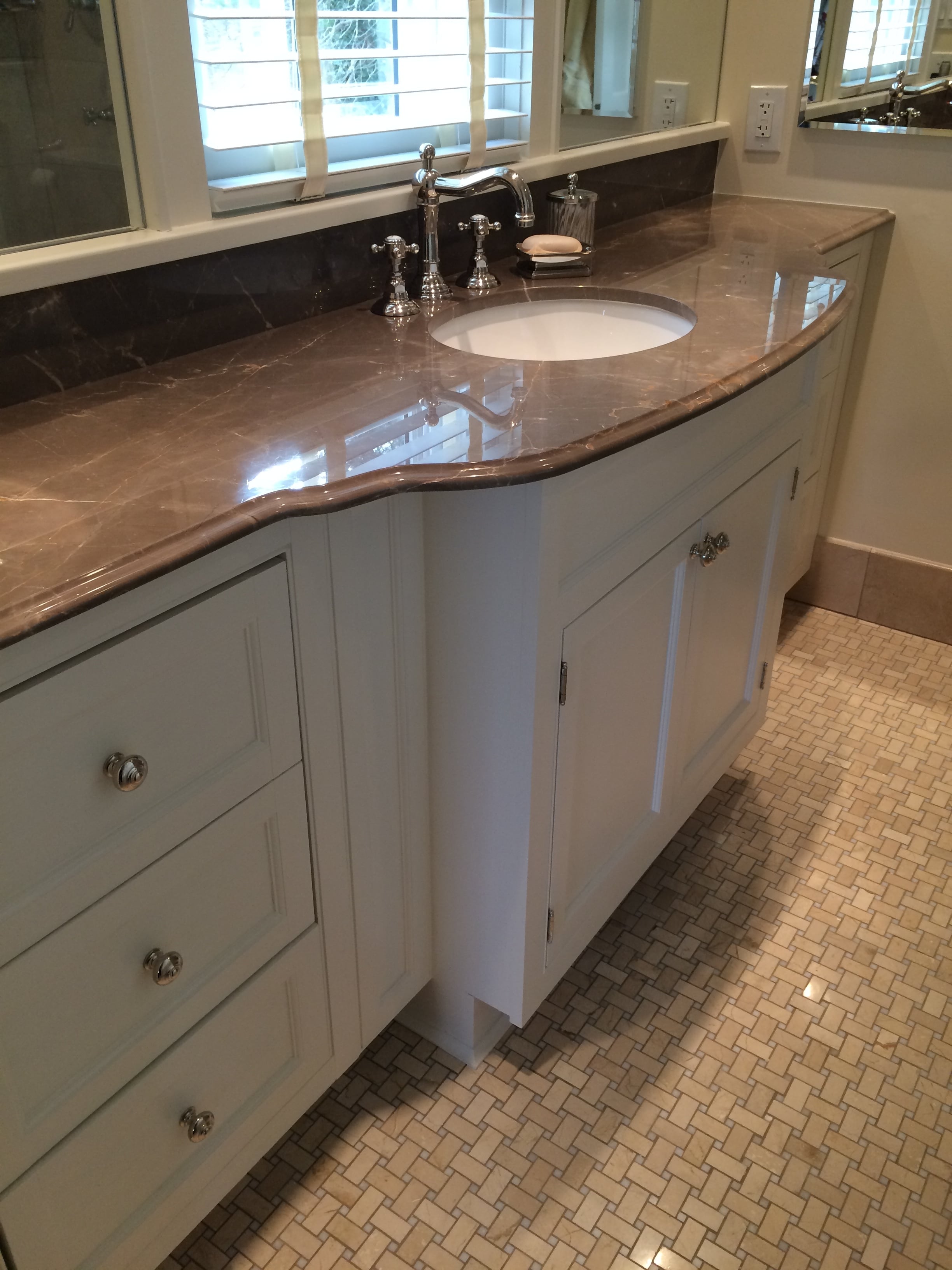 Custom designed vanity for an old home with a small master bath to maximize space and storage while creating an elegant feel.