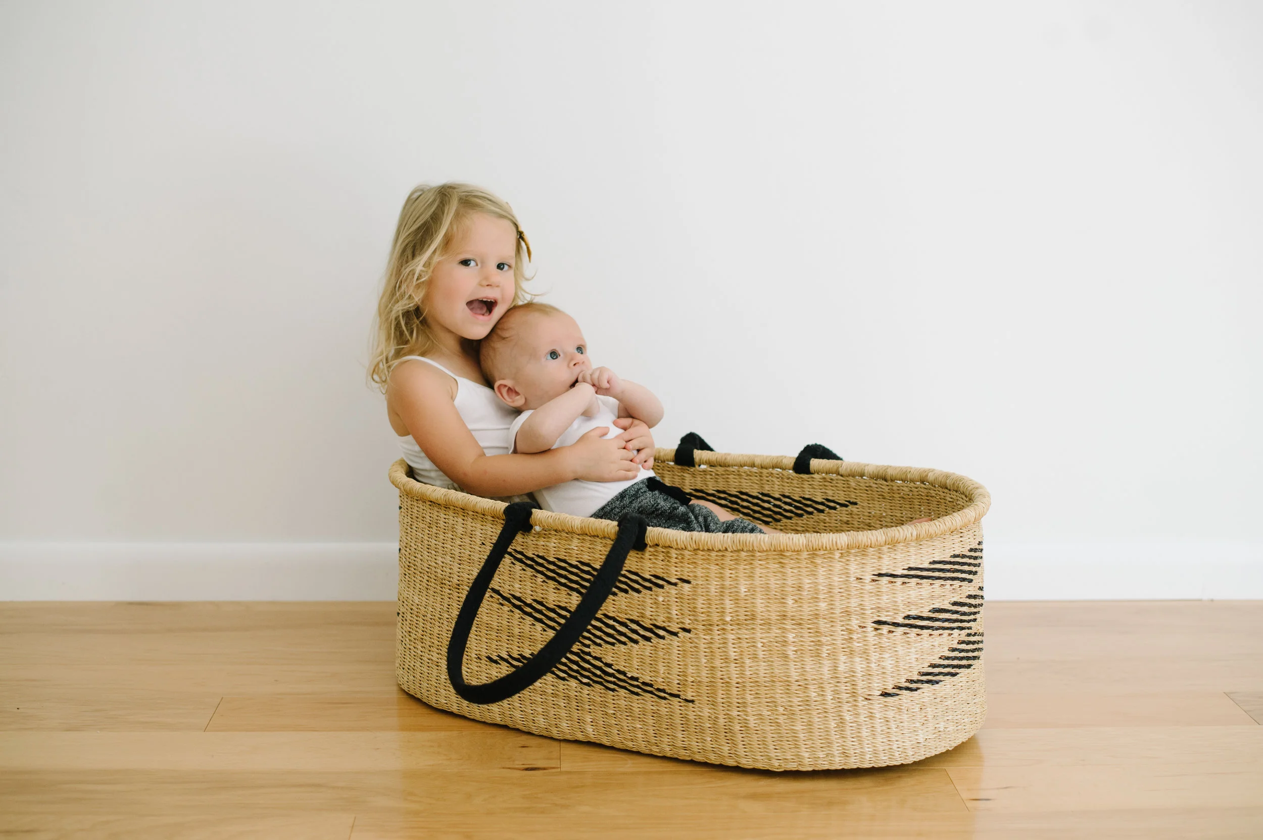 baby holding basket