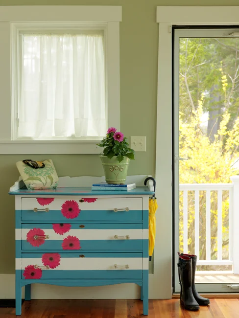 I really can’t do a SPRING DIY COLLECTION without this baby!! One of my favorite dresser redos— painted with blue and white stripes and some pink paper flowers. HERE ARE 19 PAINTED DRESSERS — YOU’LL SEE A COUPLE OF MINE IN HERE… HAPPY SPRING DIY HERE!