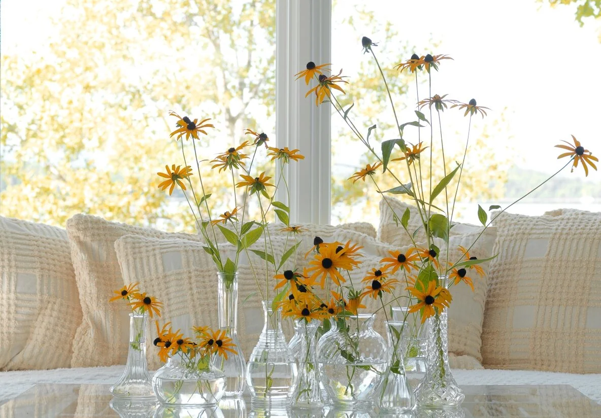 DIY… using recycled vases I picked up at Goodwill and I covered all my pillows with a coverlet my mom found at a garage sale :) Photo: Susan Teare From the book, Salvage Secrets Design & Decor