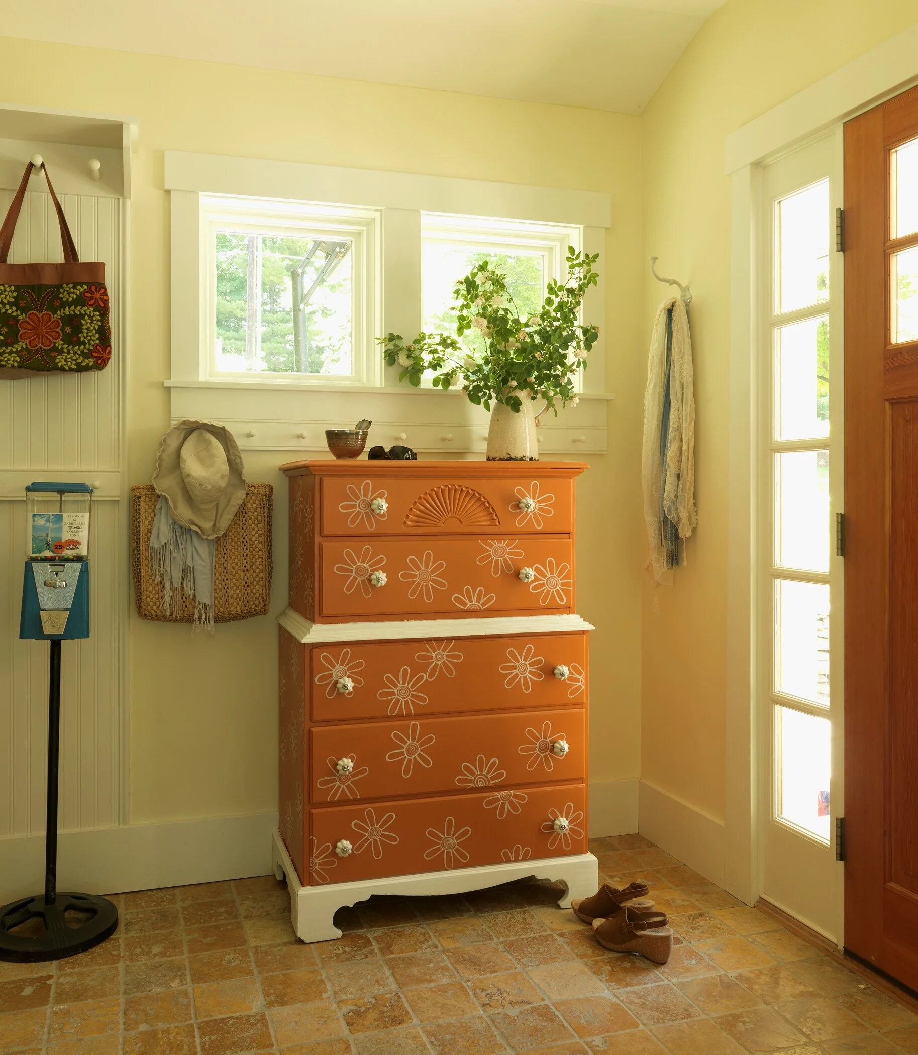 I painted an old outdated dresser giving it an orange retro look . A DIY NETWORK project.