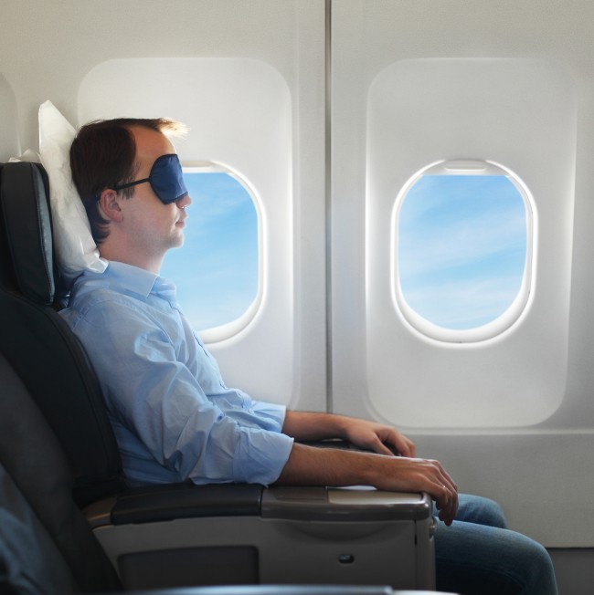 sleeping-on-plane-shutterstock_119470189_large-e1429041719441.jpg