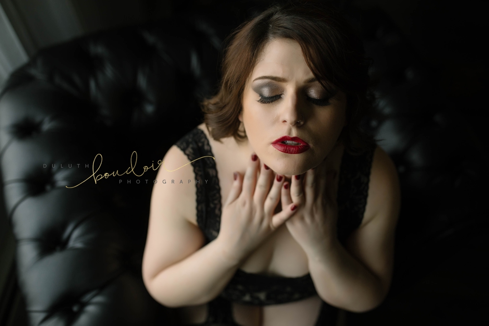 Angie wearing black lingerie with red lips for her boudoir photography session in Duluth, MN