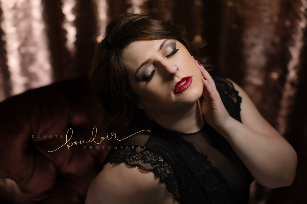 Angie wearing black lingerie with red lips for her boudoir photography session in Duluth, MN