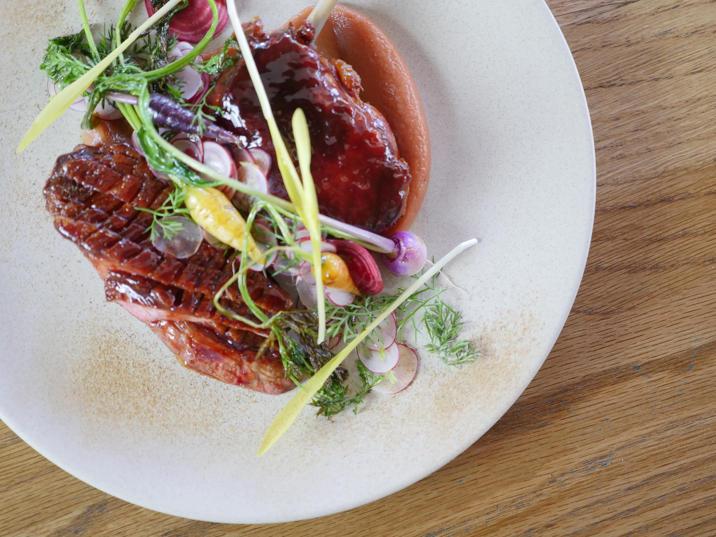 PAN ROASTED RED GATE FARM DUCK, QUINCE, RADISH, LIQUORICE, PETITE BOUCHE BABY VEGETABLES. 