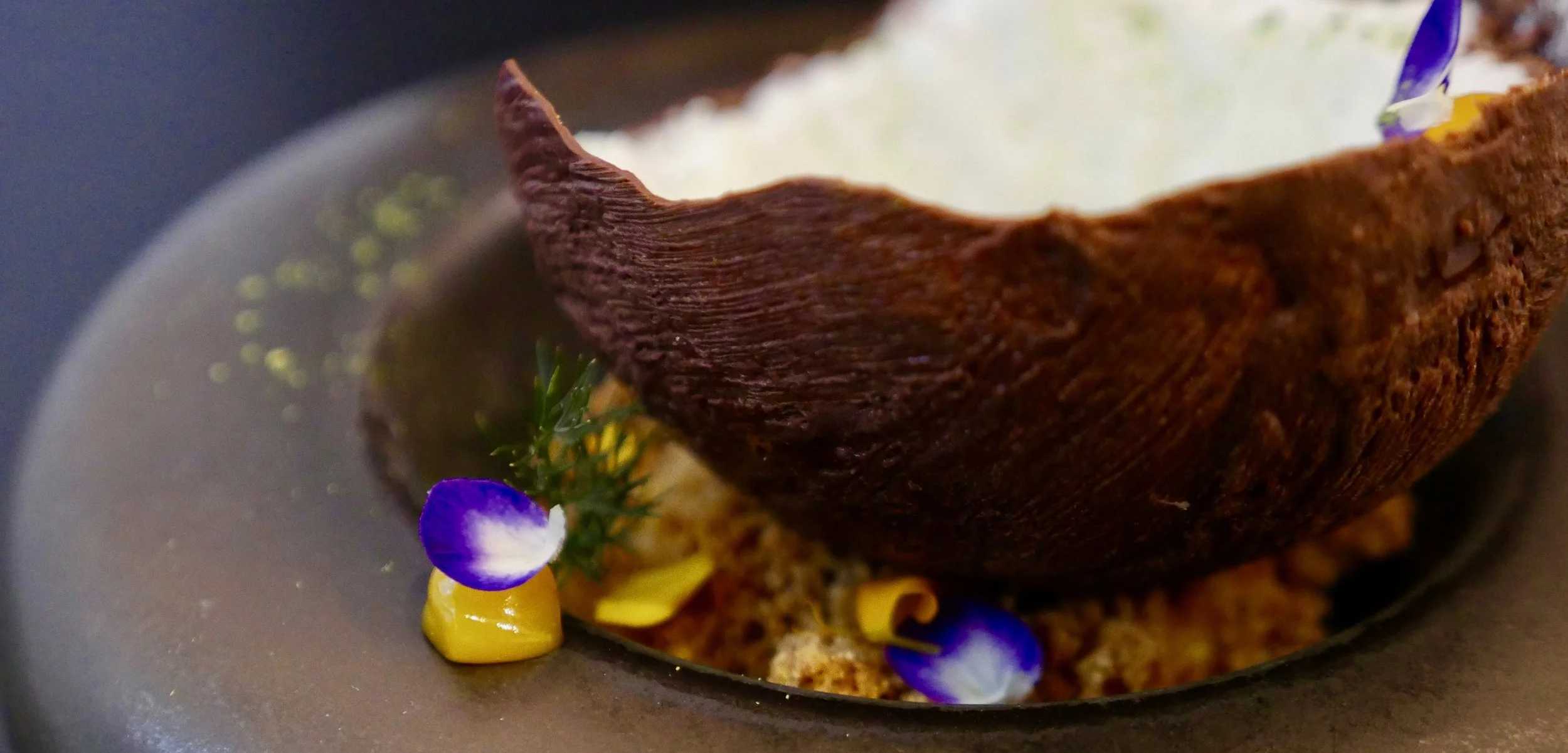 "COCONUT & YOGURT", CHOCOLATE, ALMOND SAND, PASSION FRUIT CURD, MANGO, KAFFIR LIME DUST.