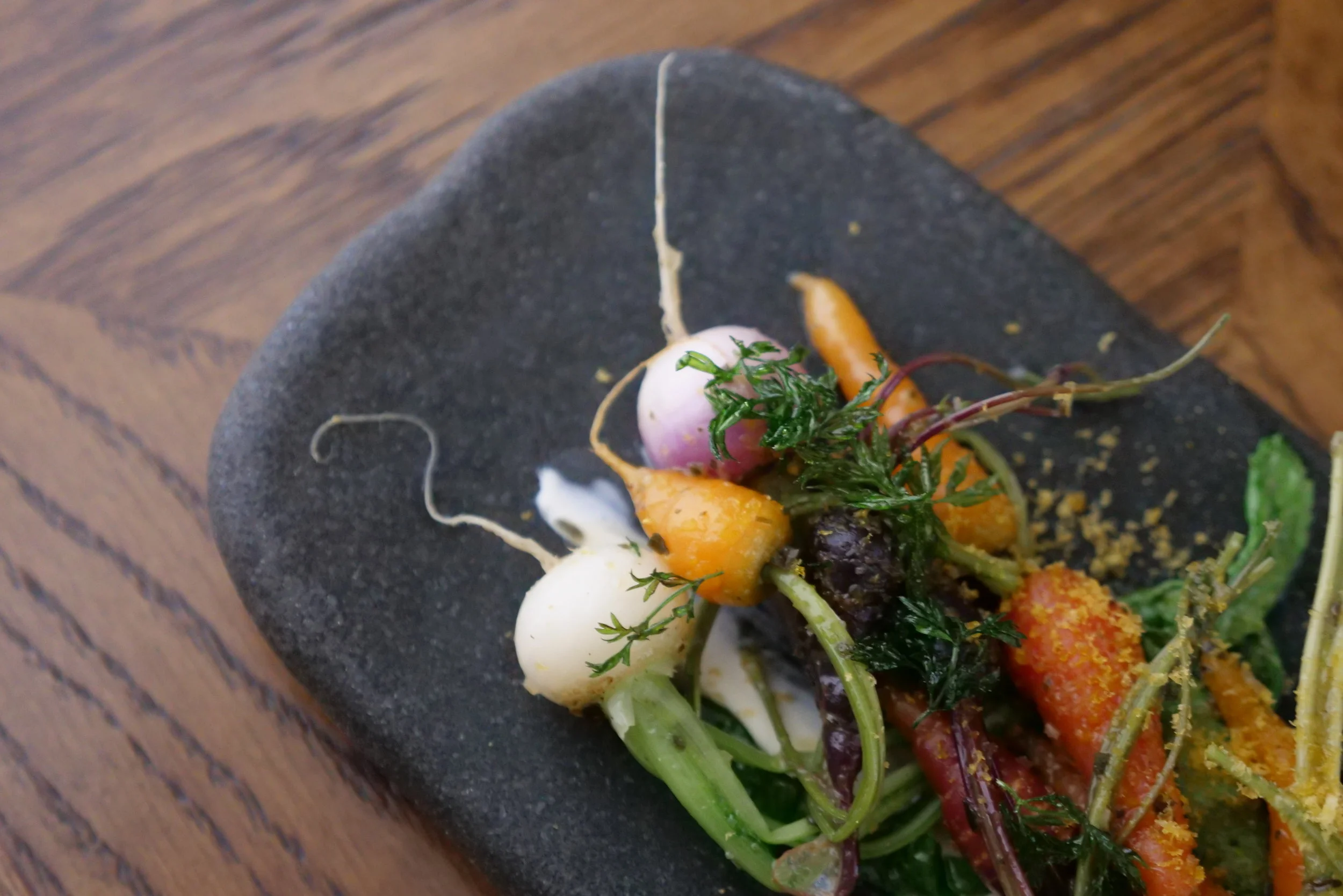 PETITE BOUCHE VEGETABLES, KOUMBOU, CREME FRAICHE, BOTAGO AND FRIED CARROT TOPS.